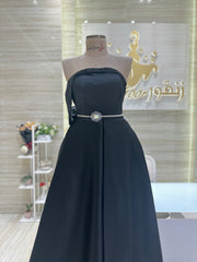 A captivating mauve, double-cloche dress with a flattering waistline, perfect for a special occasion.exclamation